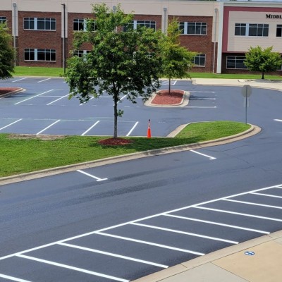 Finished Asphalt Rejuvenation of Upper Parking Lot East Wake Academy