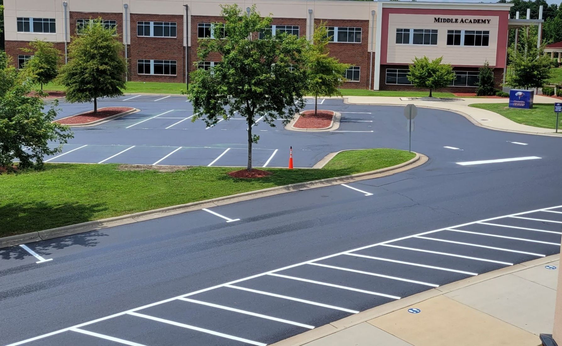 Finished Asphalt Rejuvenation of Upper Parking Lot East Wake Academy