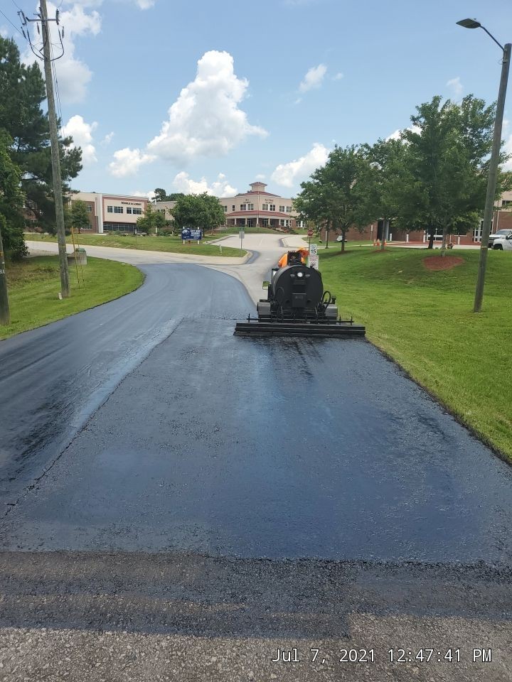East Wake Academy Zebulon Nc Projects Sealcoating Line Striping Thermoplastic Pavement Marking And Crack Filling